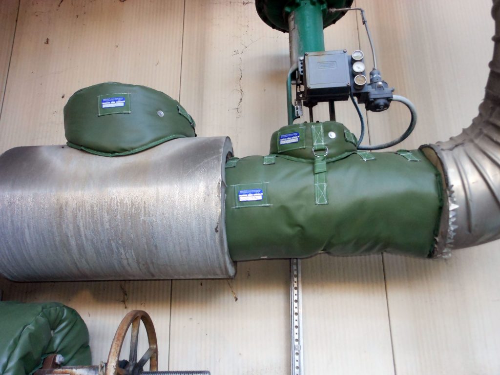 removable acoustic insulation jacket installed on industrial control valve and steam piping