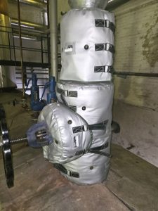 Custom-designed removable blanket insulation closely fitted to industrial equipment
