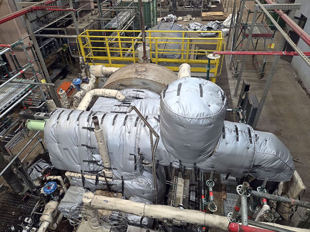 Custom removable insulation blankets installed on an industrial steam turbine during a shutdown project